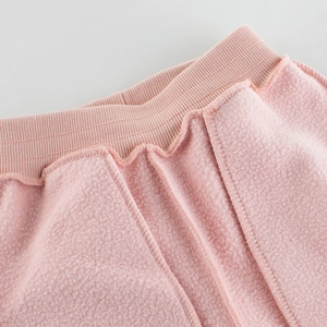 Pink fleece lined thermal pants for girls with ribbed elastic waistband and soft interior
