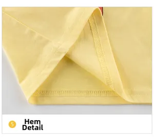 Détail de l'ourlet du t-shirt en coton jaune avec surpiqûres doubles de haute qualité