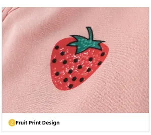 Close-up of strawberry print on pink knit fabric for children's summer shorts