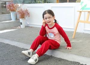 Close-up of girls cartoon rabbit print long sleeve shirt and matching pants set