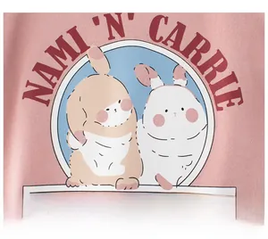Close-up of cute cartoon bunnies and letter printing on pink cotton girl's T-shirt