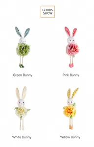 Detail of four colorful Easter bunny plush pendants with floral accents and patterned ears