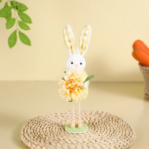Standing Easter bunny plush doll with yellow flower on a green base for mantle decor