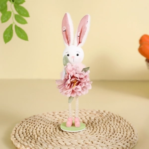 Standing Easter bunny decoration with floral ears and pink flower on green base
