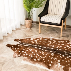 Faux fur spotted sika deer area rug on light wood flooring in a modern cozy room