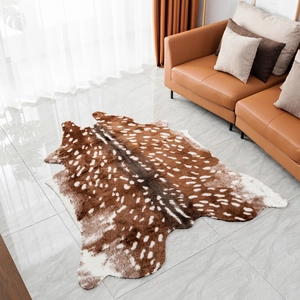 Detail view of faux deer skin rug texture showing soft brown fur and realistic white spots