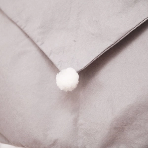 Gray Christmas chair cover with white pom-pom detail made of soft non-woven fabric