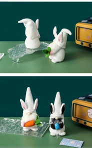 Detail of Easter gnomes with rabbit ears holding carrot and blue polka dot egg