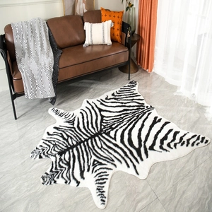 Detailed view of faux zebra skin rug with black and white stripes on marble floor