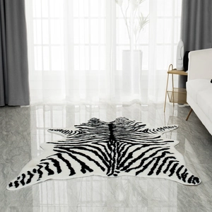 Detail view of a black and white zebra pattern rug with irregular edges on marble floor