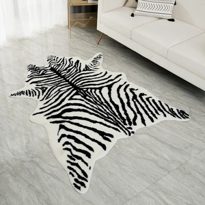 Detailed texture of black and white zebra pattern faux hide rug on marble floor