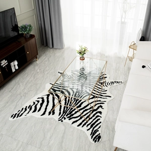 Modern black and white zebra pattern area rug with irregular edges in a minimalist living room