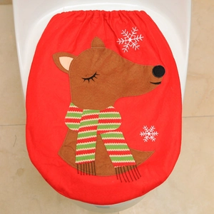 Close-up of red Christmas elk toilet seat cover with festive reindeer and snowflake embroidery