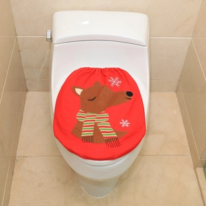 Close-up of red Christmas toilet cover with reindeer embroidery and white snowflakes