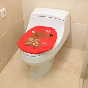 Detail of red Christmas toilet cover featuring reindeer embroidery and white snowflakes