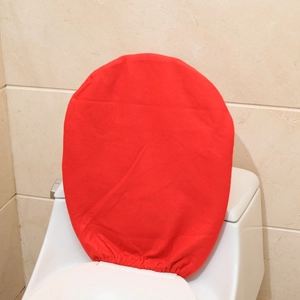 Close-up of red fabric toilet seat cover showing elastic edge design for Christmas decor