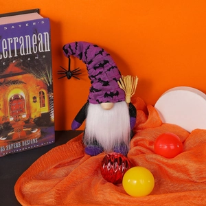 Halloween faceless gnome plush with purple bat hat holding broom and spider decor