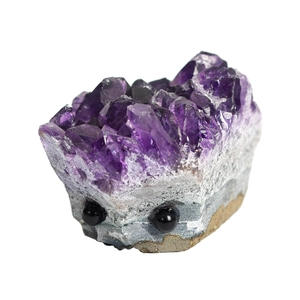 Natural amethyst crystal cluster carved in a hedgehog shape with polished dark purple points