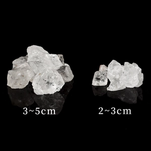 Natural white crystal rough stones in 2-5cm sizes for aromatherapy on black background