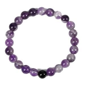 Purple amethyst beaded bracelet with one black obsidian stone on a clean white background