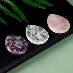 Polished teardrop crystal thumb stones in amethyst, quartz and rose quartz set