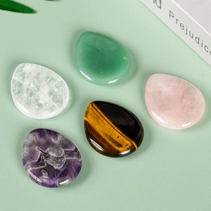 Polished natural crystal thumb stones in drop shape featuring amethyst and aventurine