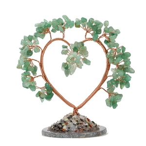 Heart-shaped crystal tree with green aventurine leaves on a natural agate slice base