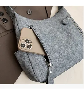 Detail view of functional side zipper pocket on a retro large capacity tote bag