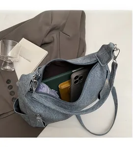 Interior view of grey-blue tote bag showing large capacity for daily essentials