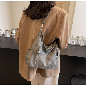 Model view of a vintage grey hobo tote bag showing its large capacity and matte texture