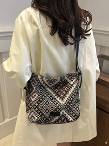Bohemian knit canvas bucket bag with colorful geometric patterns and leather strap