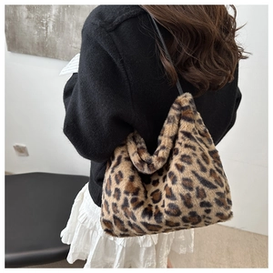 Detailed side view of large leopard print plush tote bag with soft faux fur texture