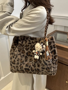 Retro leopard print faux fur tote bag with braided handle and plush charm detail