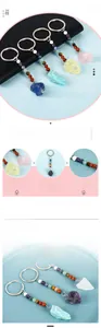 Detailed close-up of natural raw crystal keychain with various rough gemstone pendants