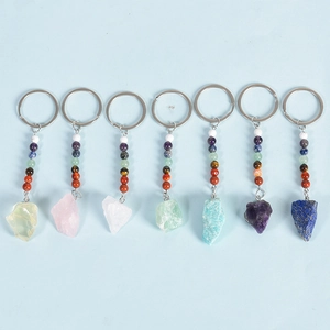 Set of seven natural crystal chakra keychains with raw gemstones and colorful beads