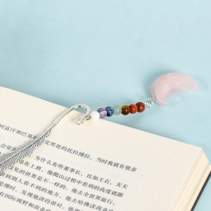 Silver metal feather bookmark with seven chakra beads and a pink quartz moon pendant