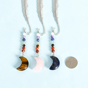 Three metal feather bookmarks with colorful natural crystal moon pendants and beads