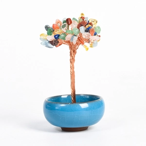 Colorful natural crystal money tree in a blue ceramic bowl for home office decoration