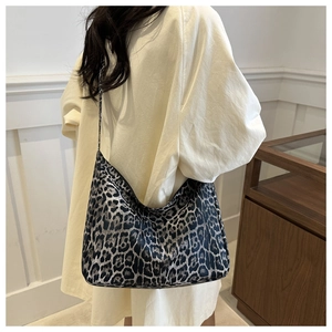 Model view of large leopard print tote bag for daily commute and casual style