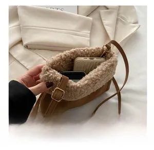 Detail view of plush bucket bag interior showing capacity for phone and card holder