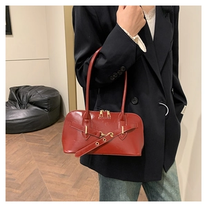 Polished wine red oil wax leather shell handbag with gold buckle for women