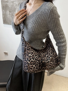 Large leopard print hobo bag with adjustable wide strap shown on model for daily style