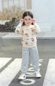 Detail of baby girl sweatshirt and joggers set with teddy bear print and pretty slogan