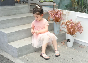 Detail of pink toddler tulle dress with short sleeves and multilayered airy mesh skirt