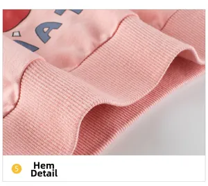 Detail of soft pink ribbed hem and high-quality cotton knit fabric on kids' sweatshirt