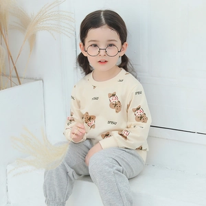 Toddler girl autumn cream sweatshirt with animal print and grey jogger pants outfit