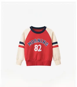 Detail of red and cream raglan sweatshirt with Morning 82 print for kids