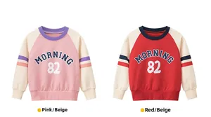 Detail of raglan sleeve sweatshirts with 'MORNING 82' print in pink and red colors