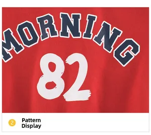 Detail of red kids sweatshirt showing navy MORNING text and white 82 graphic print