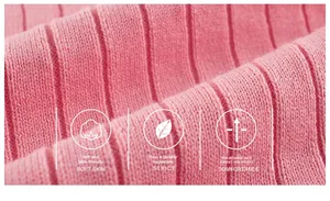 Close-up of pink ribbed knit fabric texture for soft and breathable girls' cardigan